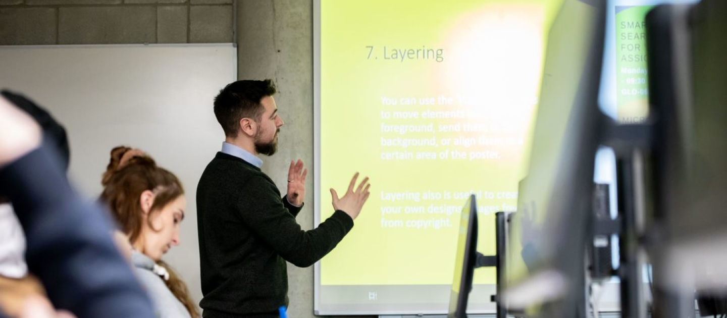 Image of a staff member presenting to students