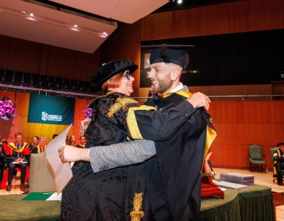 UL President Professor Kerstin Mey hugs her son, who was graduating from the university