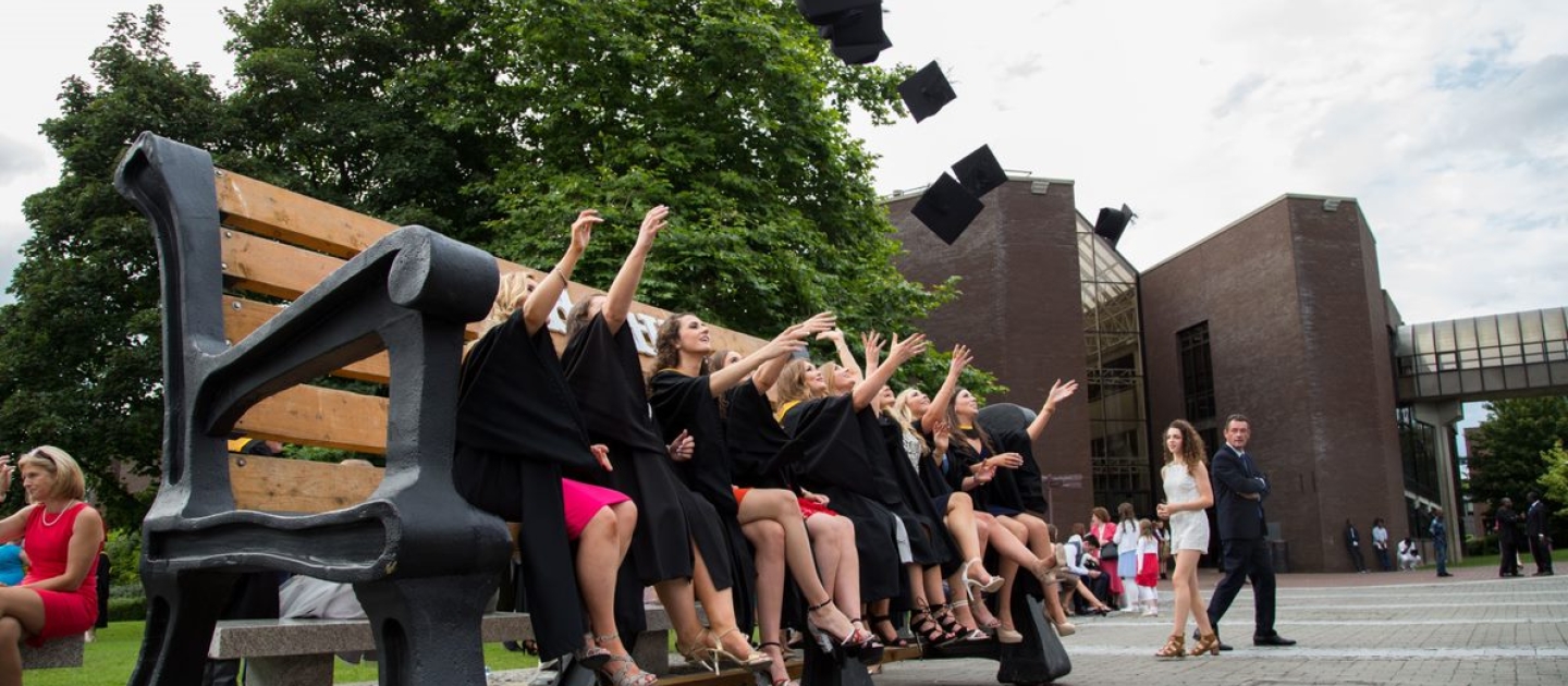 UL Graduates throwing graduation caps