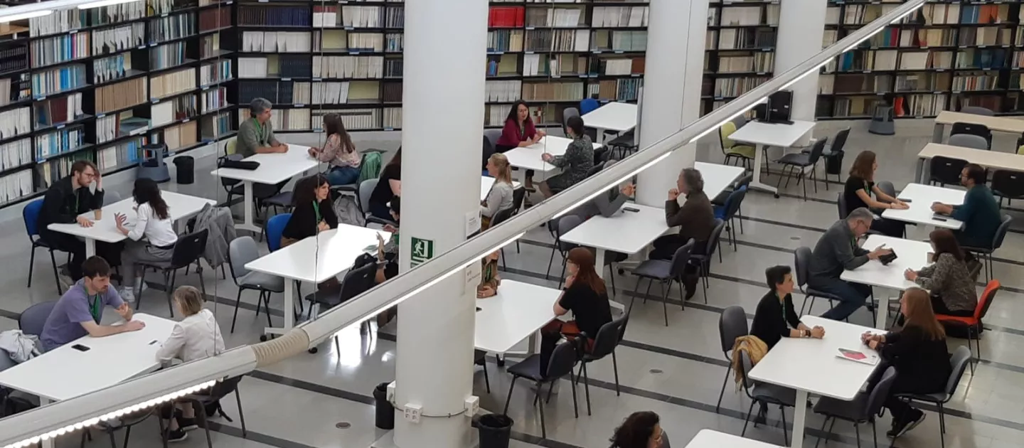 Image shows people at a table during speed dating event as part of YERUN Workshop 