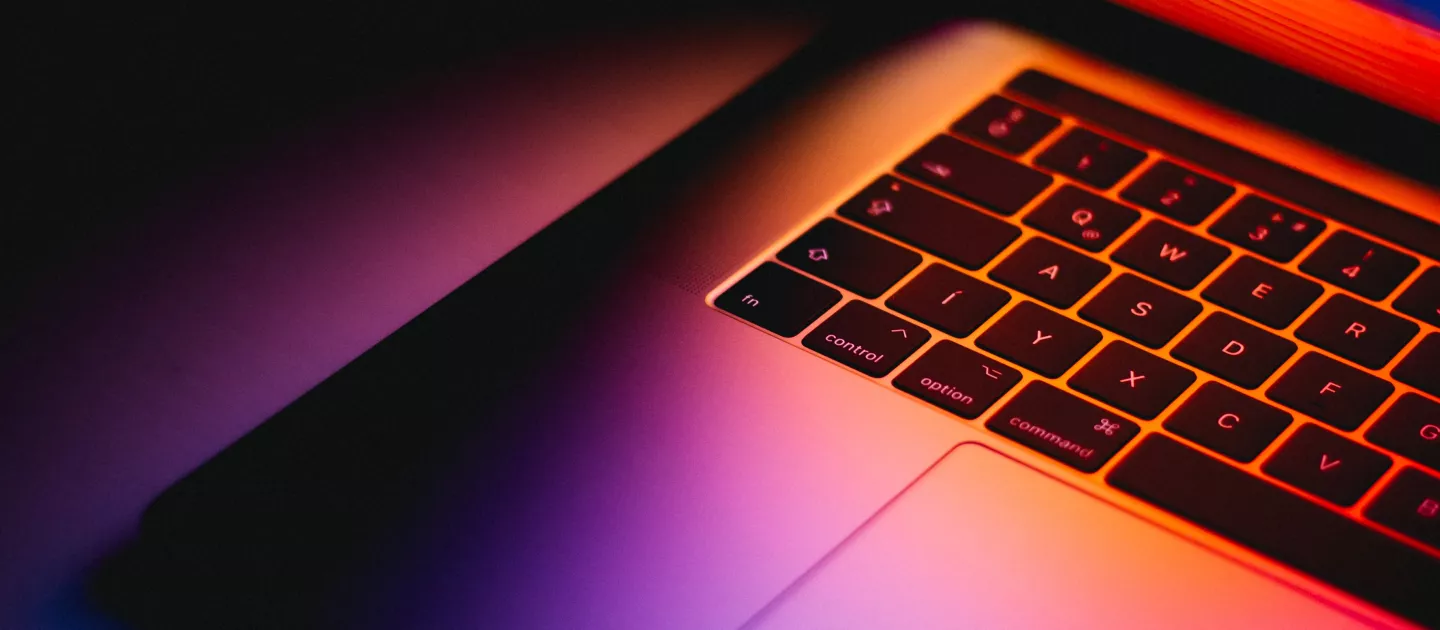 Laptop with colourful screen glow