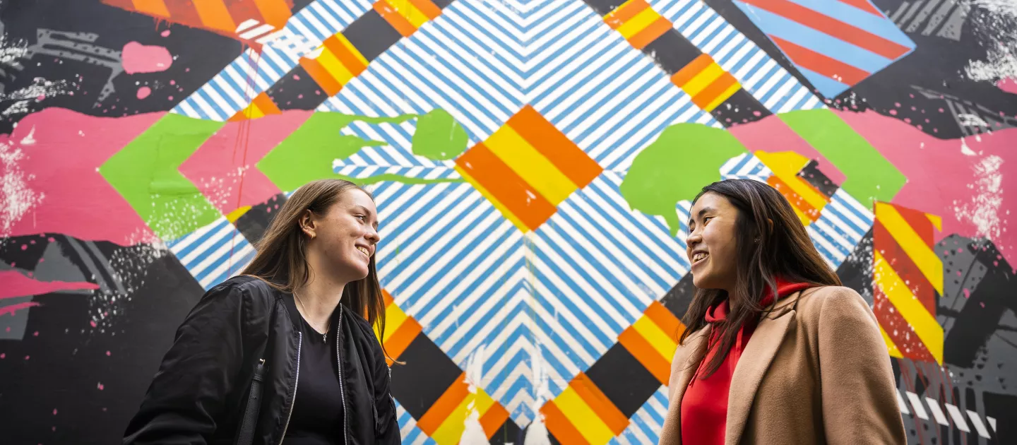 UL Students in front of street art mural