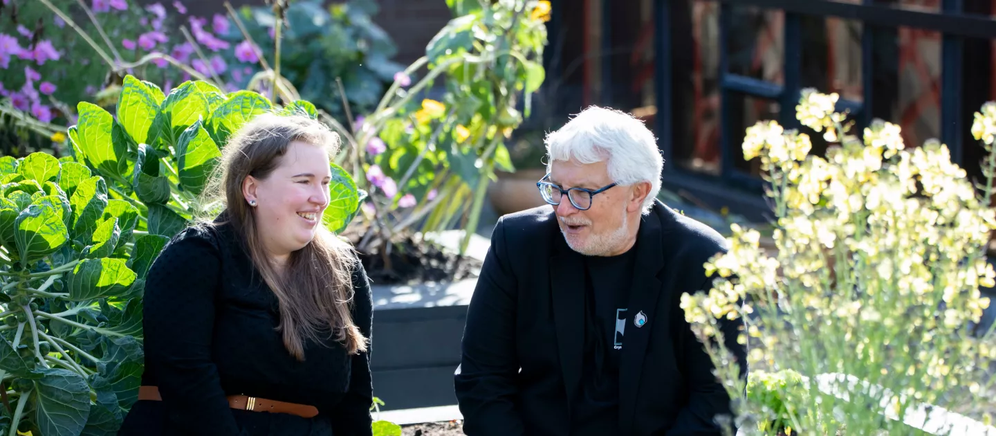 Mike and Sarah chatting outside the Bernal building