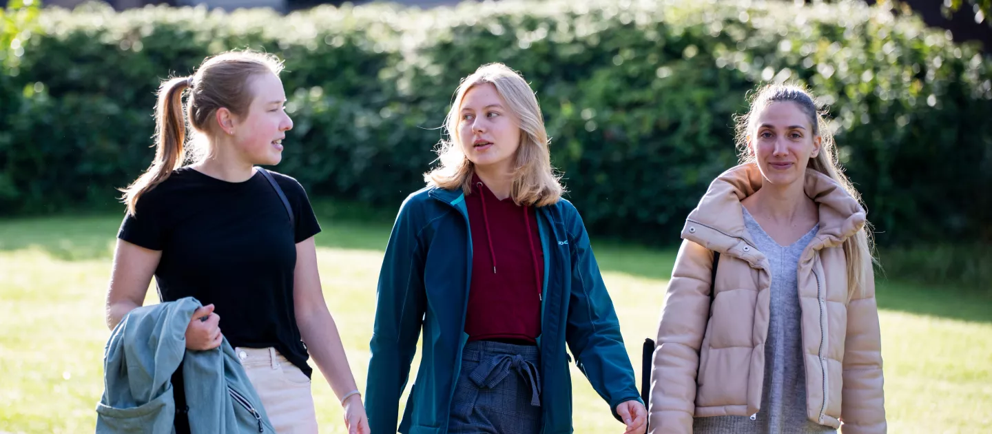 three students walking together