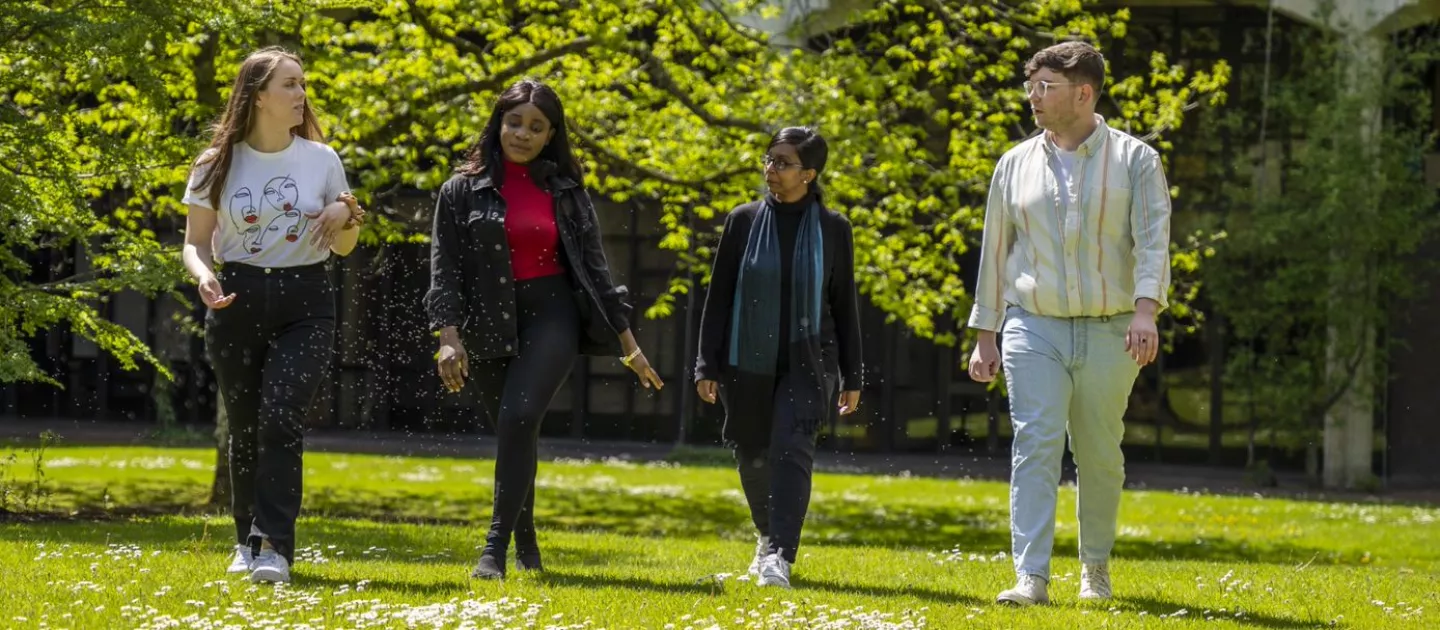 students walking on grass