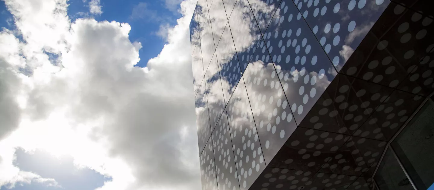 Bernal building with clouds in background