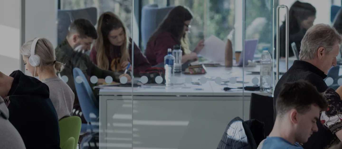 Banner image showing students studying at desks