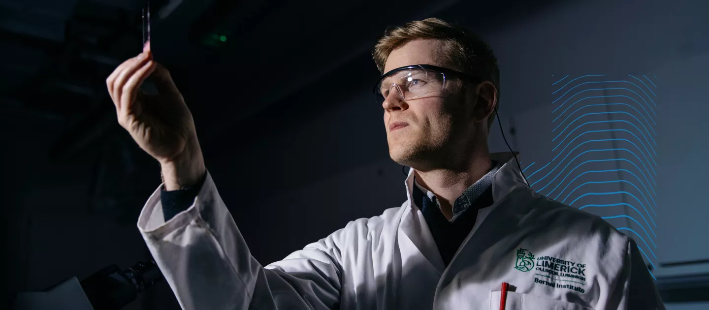 Eoghan Cunnane holding up a test tube