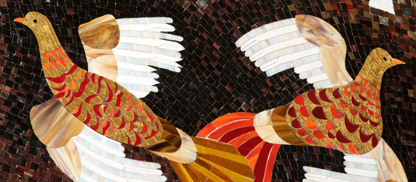 mosaic image of two birds flying