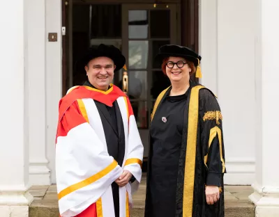 A picture of Jörg Widmann with UL President Professor Kerstin Mey