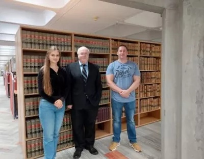 Arina Gabija Downes and Martin Ryan pictured with Professor Ray Friel