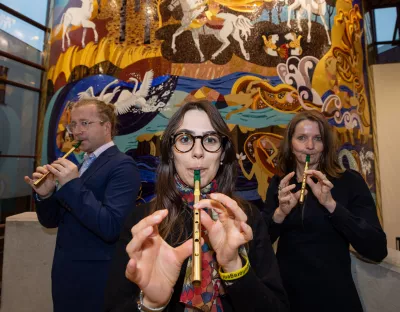 A picture of a trio playing tin whistles at the Irish World Academy