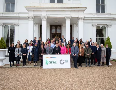 The full Athena Swan group pictured outside Plassey House at UL