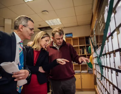 A group pictured in UL looking at the periodic table