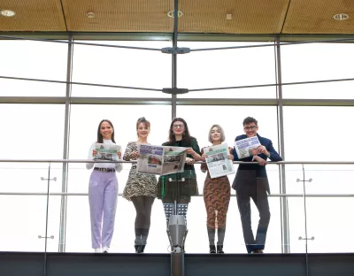 The Limerick Voice editorial team pictured on a balcony in the Glucksman Library at UL