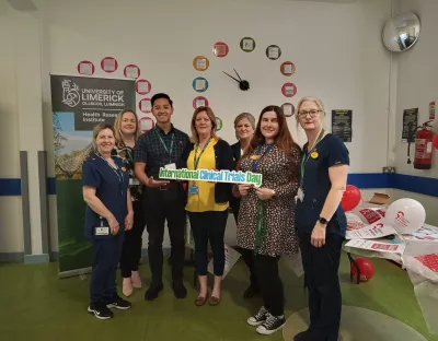 CRSU team pictured with staff from UHL with a sign that reads International Clinical Trials Day.