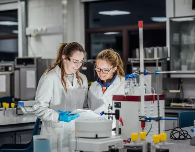 Biological Science Students Elle Sorensen and Georgina Hornsby using the Äkta Start FPLC system in a laboratory at University of Limerick