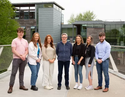 The UL students with RTÉ RnaG broadcaster Áine Hensey pictured on the Living Bridge