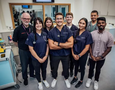 A picture of a group of students and their tutors in the new clinical simulation lab