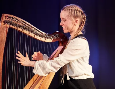 woman playing harp