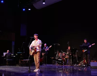 Man singing and playing guitar