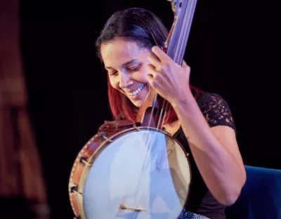 Rhiannon playing a banjo