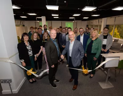 Neil Morris of AWS cutting the ribbon on the ISE space in UL