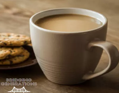 Bridging Generations logo- Cup of tea and plate of cookies