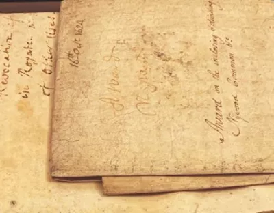 very old stained pages with old style text written on it