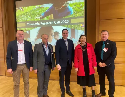 A group picture of five people at the funding announcement