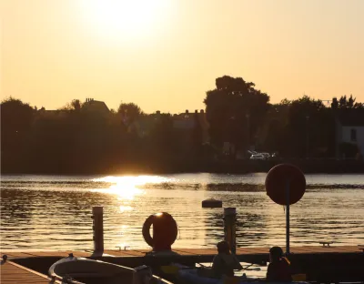 Sun setting over a lake