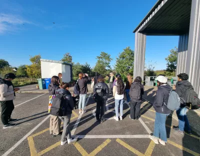 A group of students greeted by Cloughjordan Eco Village