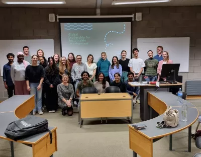 Cohort 1 of GLSD at the front of the presentation room