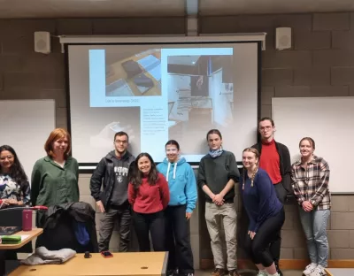 A group of students with a guest speaker