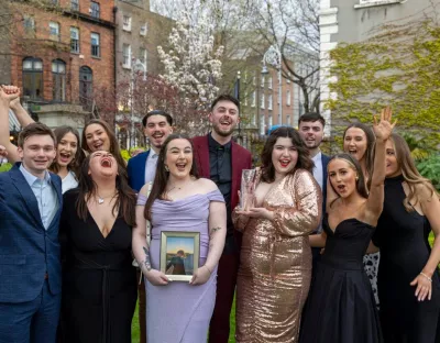 Members of the Limerick Voice, who were the winners of Newspaper of the Year, holding a picture of Joe Drennan