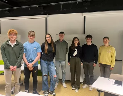 A group photo of the Sustainability Debate Teams (L to R - 1st year team: Ruan O' Dowd, Tola Bowen-MacCurtain, Mia Borko. Centre: Jack O' Connor, UL Student Sustainability Lead. 2nd year team: Rosie Kennelly, Eoghan O' Mahony, Tamar Orosz)