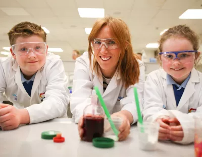 Students from Drumlea National School in Leitrim with STEMtacular founder Louise Gallager pictured taking part in a science workshop at the Department of Chemical Sciences, University of Limerick