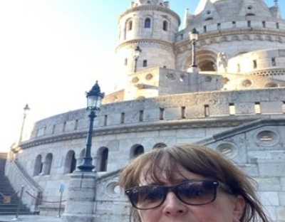 Dr Niamh Lenahan in front of a building in Budapest
