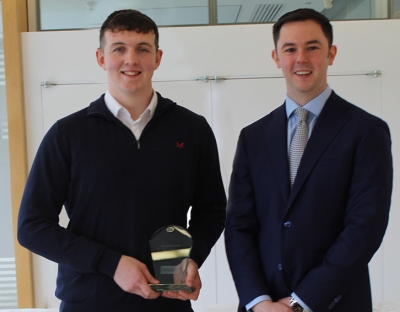 Ciarán Cronin being presented with his award by Stuart Kennedy (Matheson partner, finance and capital markets)