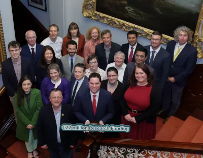 A group of people with the Minister announcing the funding