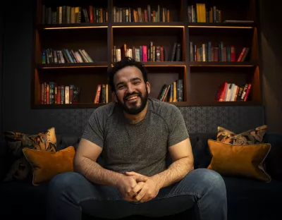 Mostafa Darwish, seated and smiling at camera