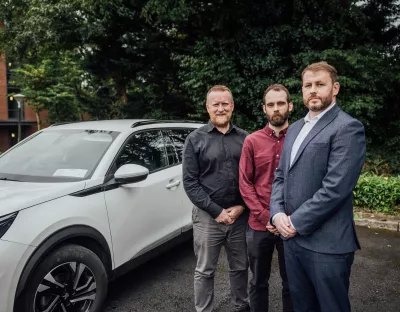 Three men pictured next to a white car on the UL campus - they are Lero-UL researchers Professor Finbarr Murphy, Kevin McDonnell and Dr Barry Sheehan 