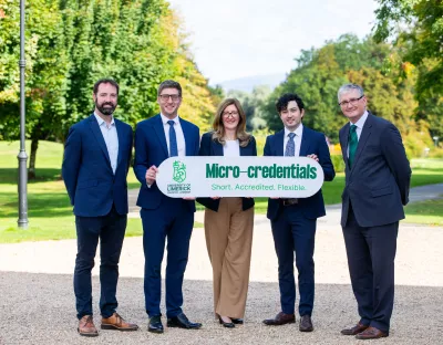 UL launches partnership with Skillnet - five people are pictured on the campus holding a white sign