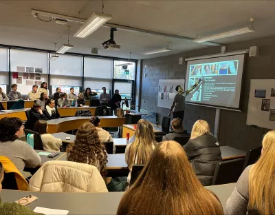 students listening to speaker at Linguistic Landscape Exhibition