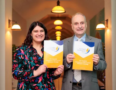 UL researcher Dr Niamh Cummins pictured with Pat Fleming, Chair of the PHECC Research Committee - they are pictured indoors and are holding documents