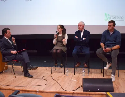 4 speakers on stage in the concert hall