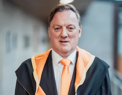 A picture of Paul Kelleher, Vice President of Engineering for QT Technologies Ireland Limited in his conferring robes