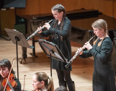 Two student playing the oboe