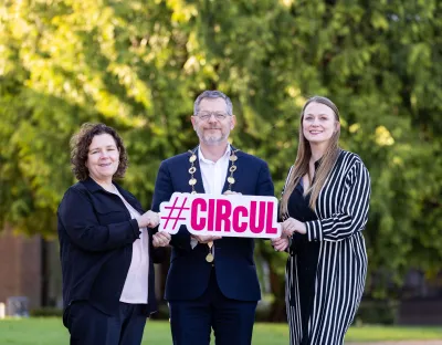 Sandra Joyce, Mayor John Moran and Laura Keyes pictured at the launch - outside on the UL campus holding a sign that says CIRcUL