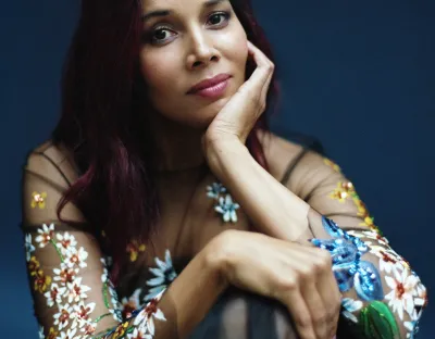 Rhiannon Giddens sitting on chair